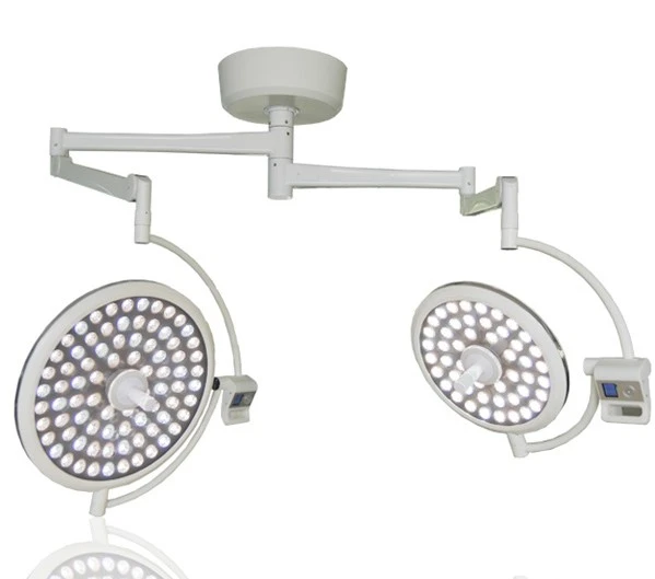 Double arm theatre lamp providing bright surgical illumination in operating rooms
